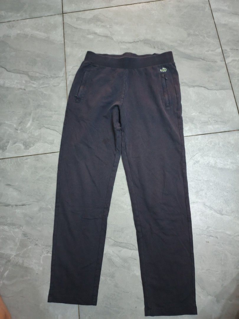 Lacoste Dark Grey Sweatpants Size M (Category: Jeans) located in Bulacan. Submitted by gratsy (Listing ID 1462451510, Image 1). Description: - Brand: Lacoste - Color: Dark Grey - Material: 100% Cotton - Features: Elastic waistband with drawstring, two side pockets - Size: M (fits 160/68A) - Ideal for: Lounging, casual wear.
