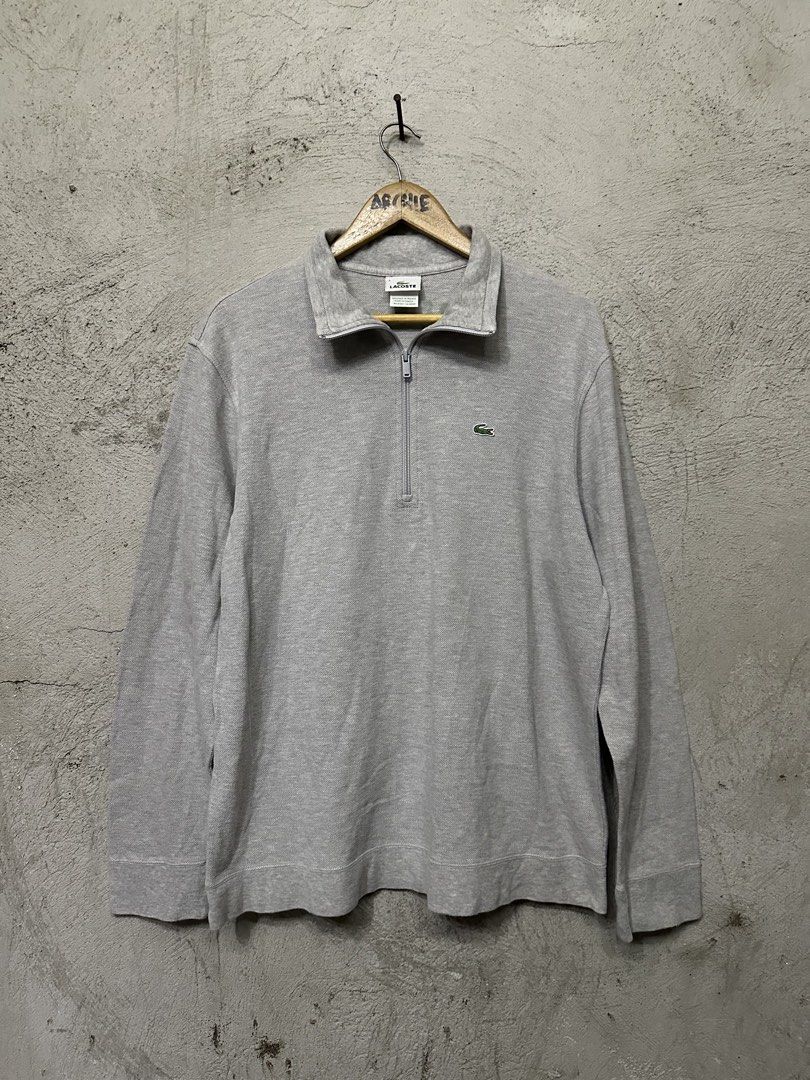Lacoste Grey Quarter Zip Long Sleeve Sweatshirt (Category: Coats, Jackets and Outerwear) located in Quezon City. Submitted by stre3tw3ar (Listing ID 1462614826, Image 1). Description: - Grey Lacoste sweatshirt - Quarter zip neckline with a collar - Small green crocodile logo on the chest - Lacoste text embroidered on the back collar - Long sleeves with ribbed cuffs and hem - Made in Tunisia.