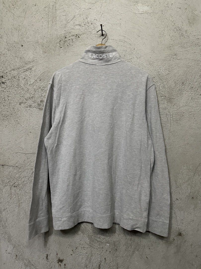 Lacoste Grey Quarter Zip Long Sleeve Sweatshirt (Category: Coats, Jackets and Outerwear) located in Quezon City. Submitted by stre3tw3ar (Listing ID 1462614826, Image 3). Description: - Grey Lacoste sweatshirt - Quarter zip neckline with a collar - Small green crocodile logo on the chest - Lacoste text embroidered on the back collar - Long sleeves with ribbed cuffs and hem - Made in Tunisia.