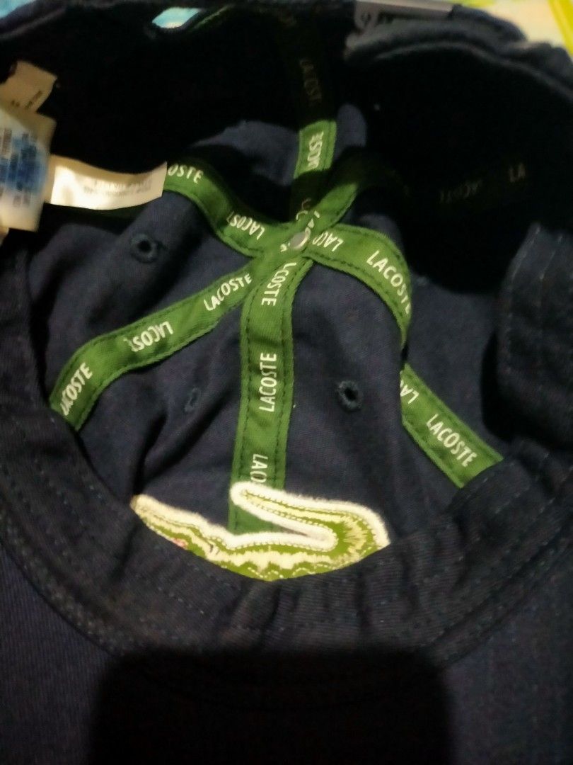 Lacoste Navy Blue Cap with Crocodile Logo (Category: Caps & Hats) located in Makati City. Submitted by lemron18 (Listing ID 1462482497, Image 3). Description: - Classic navy blue Lacoste cap - Features the iconic green crocodile logo on the front - Adjustable strap at the back for a comfortable fit - Made from durable material - Perfect for everyday wear or sports activities.
