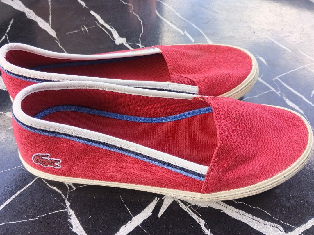Lacoste Red Canvas Slip-On Shoes (Category: Sneakers) located in Tanza. Submitted by antares0048 (Listing ID 1462445196, Image 3). Description: NOT UKAY - Red canvas slip-on shoes by Lacoste - White rubber sole with blue and white trim - Perfect for casual outings, easy to wear - Features the iconic embroidered Lacoste crocodile logo - Soles show only minimal signs of wear.