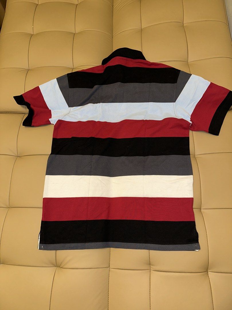 Lacoste Striped Polo Shirt (Category: Tshirts & Polo Shirts ) located in Quezon City. Submitted by mancave_stuff (Listing ID 1462483528, Image 2). Description: - Classic Lacoste polo shirt -Color rate: 9.5/10 - Horizontal stripe design - Iconic embroidered crocodile logo on chest - Made in France - Tag size: 5 (20 x 26) - Ideal for casual wear -No issue.
