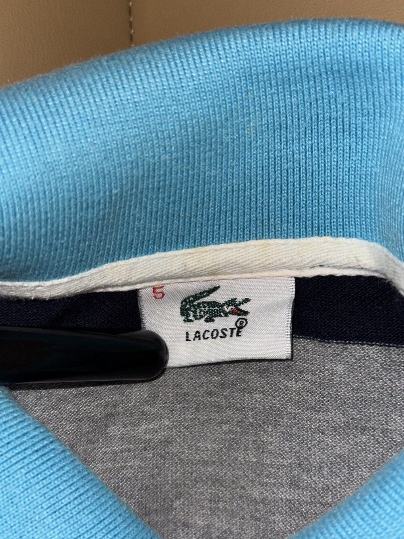 Lacoste Striped Polo Shirt Size 5 (Category: Tshirts & Polo Shirts ) located in Quezon City. Submitted by mancave_stuff (Listing ID 1462485273, Image 3). Description: - Classic Lacoste polo shirt - Size: 5 - Design: Horizontal stripes in blue, brown, grey, white, and navy - Detail: Small embroidered crocodile logo on the chest - Origin: Made in France -No issue.