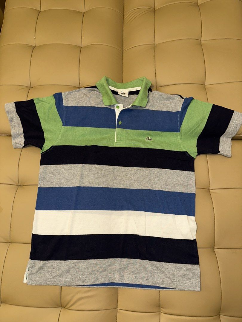 Lacoste Striped Polo Shirt Size 5 (Category: Tshirts & Polo Shirts ) located in Quezon City. Submitted by mancave_stuff (Listing ID 1462485991, Image 1). Description: - Classic Lacoste polo shirt - Horizontal stripes in green, blue, navy, and grey - Small embroidered crocodile logo on chest - Tagged size 5 (20 x 25) - Made in France - Ideal for casual wear.