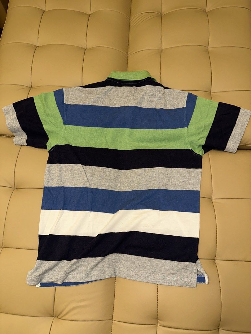 Lacoste Striped Polo Shirt Size 5 (Category: Tshirts & Polo Shirts ) located in Quezon City. Submitted by mancave_stuff (Listing ID 1462485991, Image 2). Description: - Classic Lacoste polo shirt - Horizontal stripes in green, blue, navy, and grey - Small embroidered crocodile logo on chest - Tagged size 5 (20 x 25) - Made in France - Ideal for casual wear.