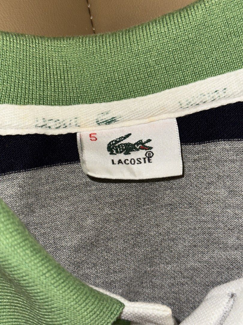 Lacoste Striped Polo Shirt Size 5 (Category: Tshirts & Polo Shirts ) located in Quezon City. Submitted by mancave_stuff (Listing ID 1462485991, Image 3). Description: - Classic Lacoste polo shirt - Horizontal stripes in green, blue, navy, and grey - Small embroidered crocodile logo on chest - Tagged size 5 (20 x 25) - Made in France - Ideal for casual wear.