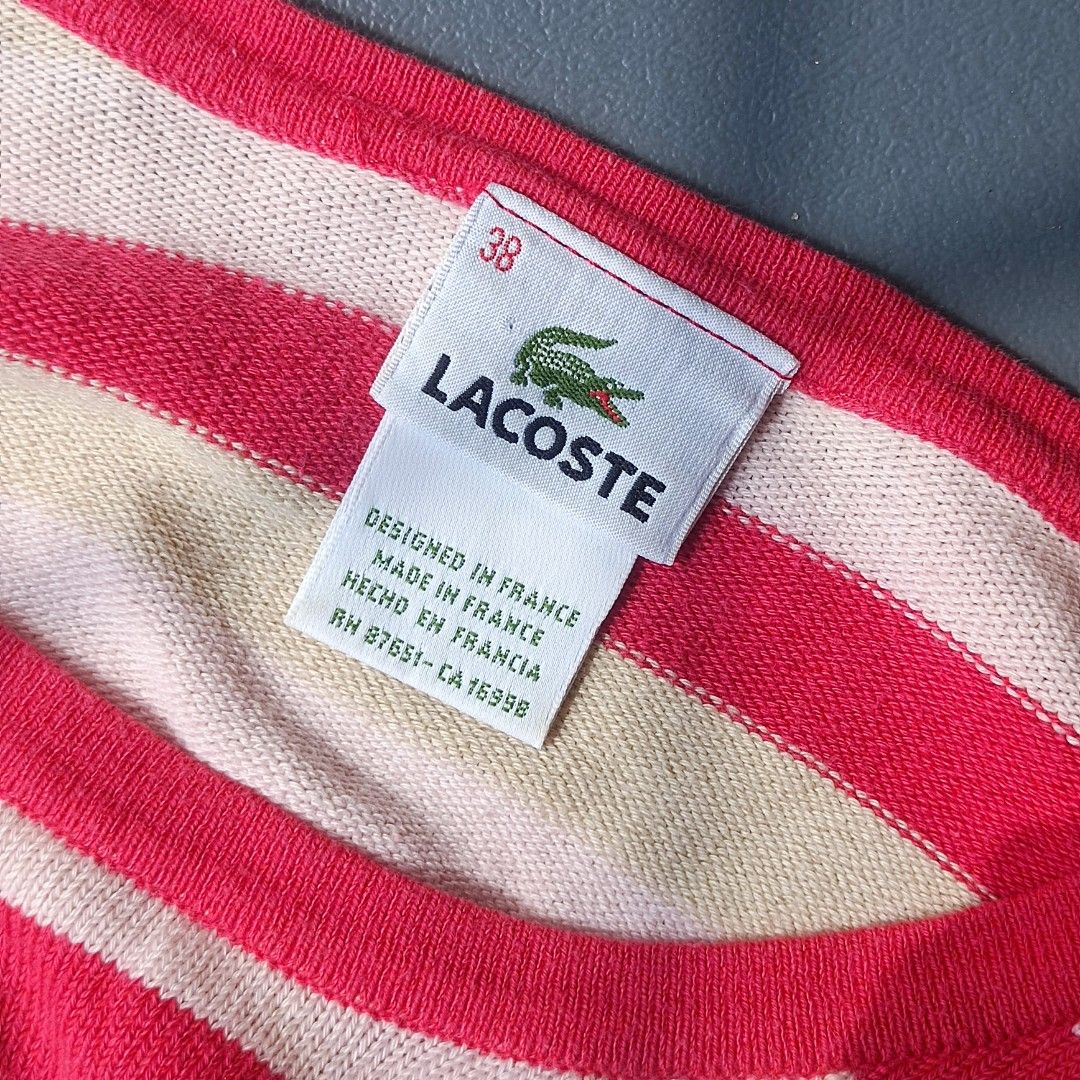 Lacoste Striped Sweater Long Sleeve Size 38 (Category: Longsleeves) located in Pasig City. Submitted by prelovedbym33 (Listing ID 1462459758, Image 3). Description: - Classic Lacoste sweater - Red and cream all-over stripes - Long sleeves - Iconic crocodile logo on chest - Made in France - Size 38 - Great for casual wear.