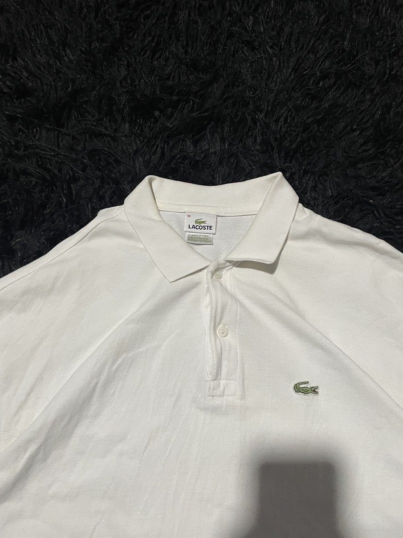 Lacoste White Polo Shirt Size 10 (Category: Tshirts & Polo Shirts ) located in Munoz. Submitted by bb_jimbo0 (Listing ID 1462624969, Image 2). Description: - Classic white Lacoste polo shirt - Iconic crocodile logo on chest - Made in Peru - Size 10 - Versatile for casual or smart-casual outfits - Timeless and simple design.