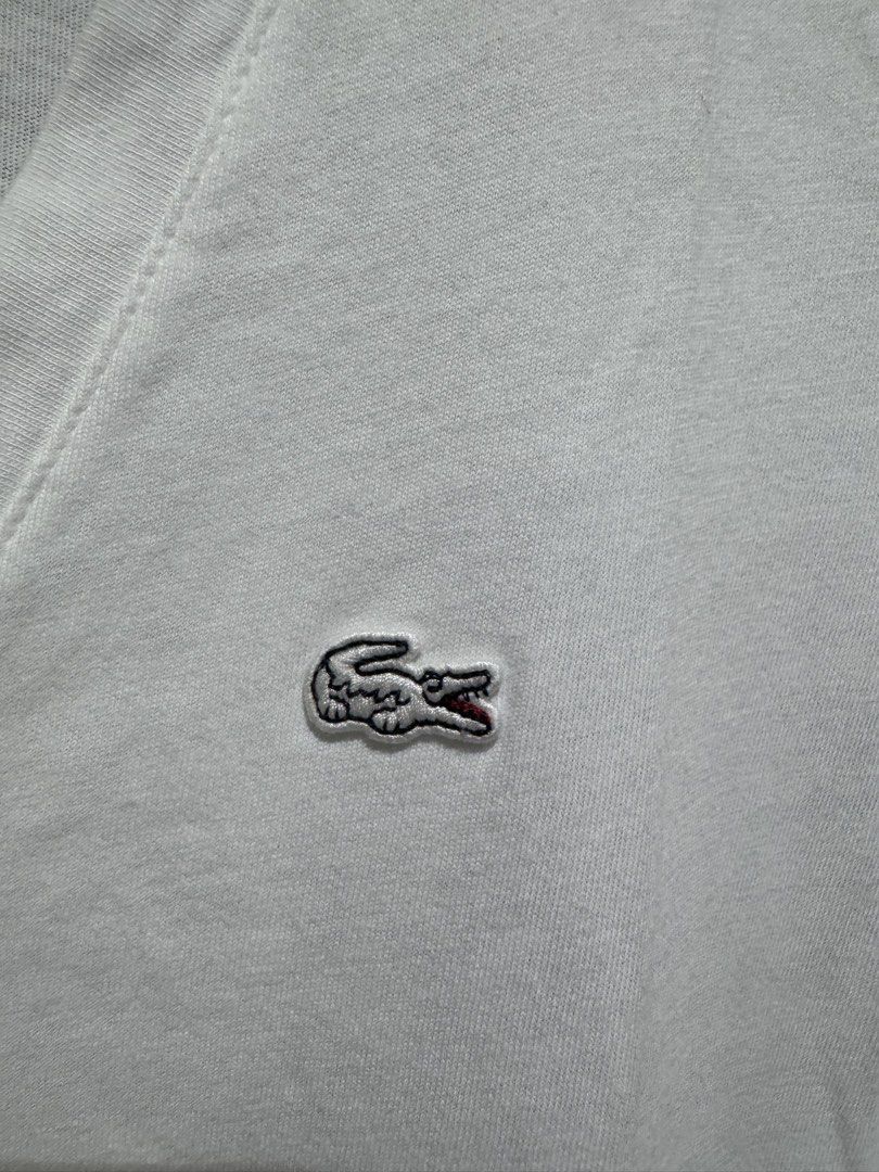 Lacoste white Vneck tshirt (Category: Shirts) located in Valenzuela. Submitted by shop.spark.joy (Listing ID 1462672022, Image 3). Description: L- 24 in W- 16.5 in.