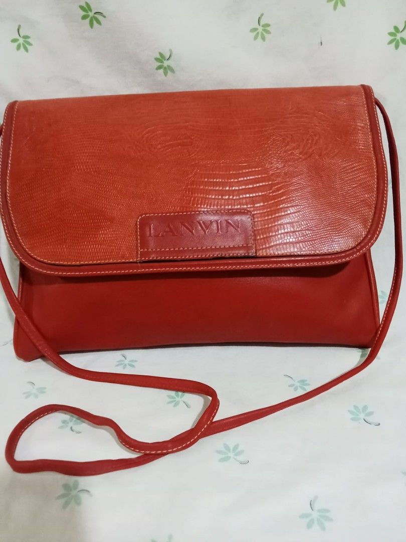 Lanvin Red Leather Shoulder Bag (Category: Shoulder Bags) located in Baguio. Submitted by sheren_signatures (Listing ID 1462620483, Image 1). Description: - Genuine red leather shoulder bag by Lanvin - Textured flap with secure magnetic snap closure - Interior zippered pocket for essentials - Adjustable strap for comfortable wear - Classic and versatile design, suitable for everyday or evening use.