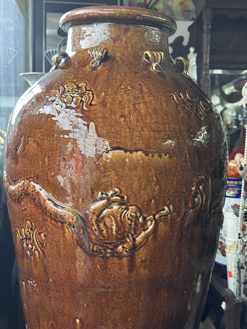 Large Vintage Brown Ceramic Dragon Vase (Category: Vases & Decorative Bowls) located in Quezon City. Submitted by anjherga27 (Listing ID 1462561278, Image 2). Description: - Big brown ceramic vase - Dragon and cloud motifs - Rustic, glazed finish - Approx. 32 inches tall - Opening is about 6 inches wide - Ideal for large floral arrangements or as a statement piece.