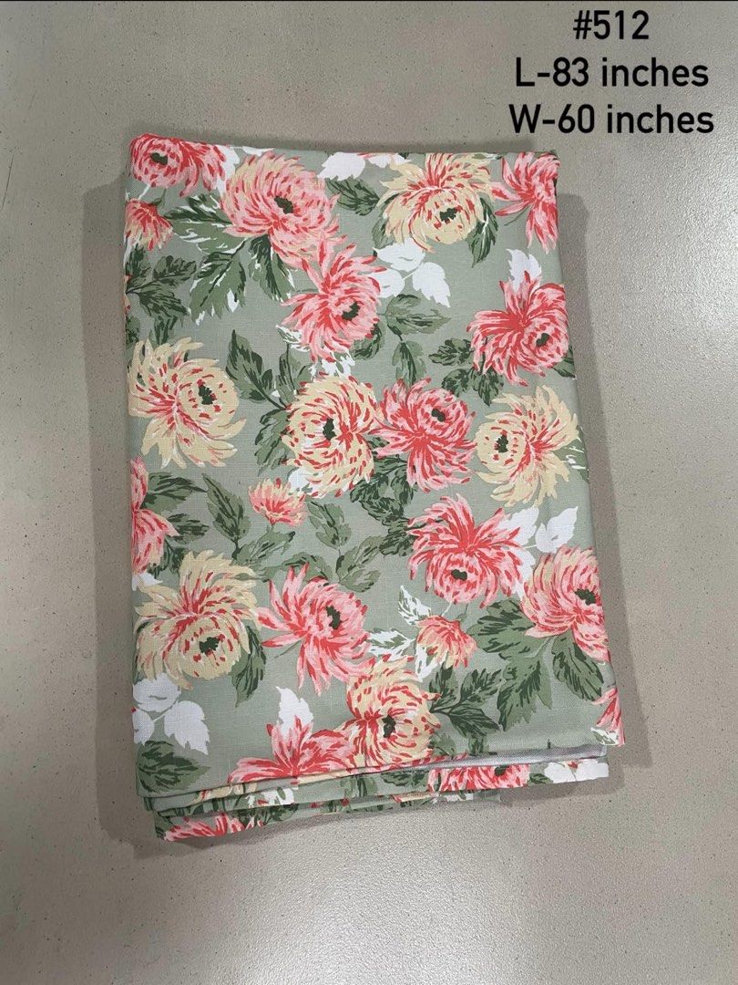 Laura Ashley Floral Fabric Tablecloth (Category: Table Linen & Textiles) located in Quezon City. Submitted by meggoquingco (Listing ID 1462554516, Image 1). Description: - Beautiful floral fabric from Laura Ashley - Features a pink and yellow floral print on a sage green background - Dimensions: 83 inches long x 60 inches wide - Ideal for sewing projects, curtains, or upholstery - High-quality material.