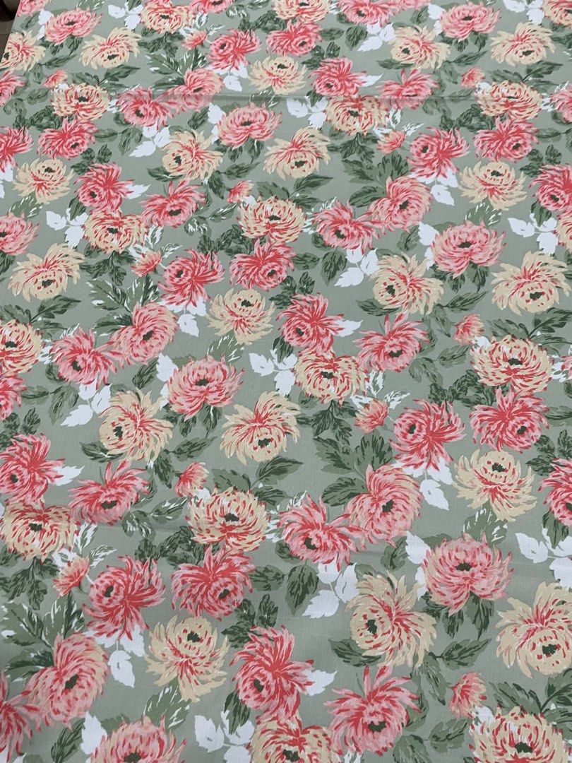 Laura Ashley Floral Fabric Tablecloth (Category: Table Linen & Textiles) located in Quezon City. Submitted by meggoquingco (Listing ID 1462554516, Image 3). Description: - Beautiful floral fabric from Laura Ashley - Features a pink and yellow floral print on a sage green background - Dimensions: 83 inches long x 60 inches wide - Ideal for sewing projects, curtains, or upholstery - High-quality material.