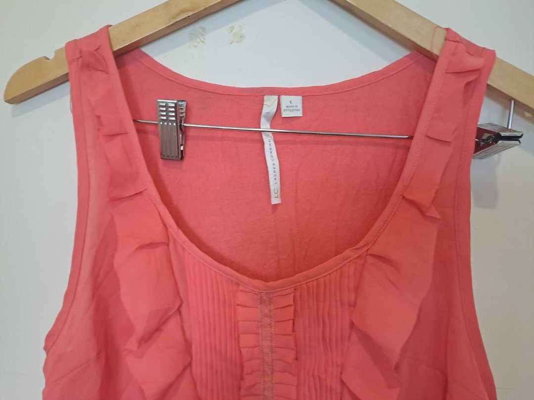 Lauren Conrad sleeveless (Category: Sleeveless) located in Mandaluyong City. Submitted by epicowl-c93c (Listing ID 1462579499, Image 2). Description: The image shows a coral sleeveless ruffle-front tank top by Lauren Conrad.