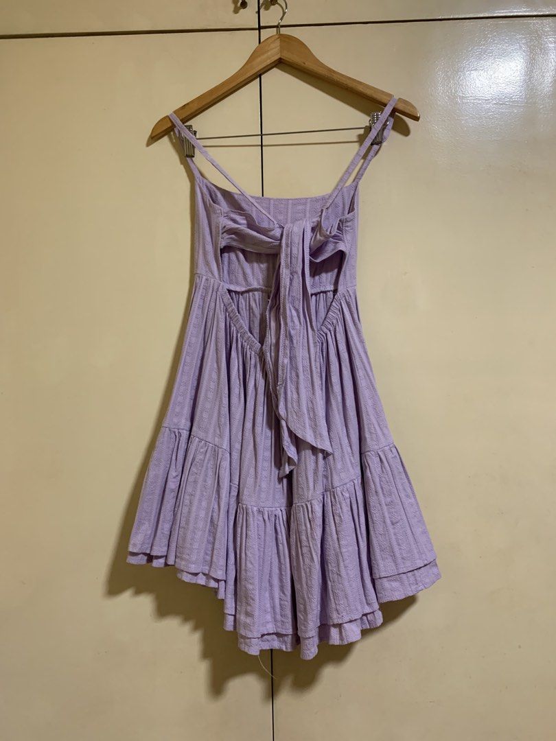 Lavender Tiered Mini Dress with Tie Back (Category: Dresses) located in Muntinlupa City. Submitted by sheisthestars (Listing ID 1462597994, Image 3). Description: Lavender Tiered Mini Dress with Tie Back- Adorable lavender mini dress - Features a tiered skirt for a playful look - Chic tie-back detail for adjustable fit - Subtle textured fabric adds a unique touch - Adjustable spaghetti straps for comfort - Versatile for casual days or summer even