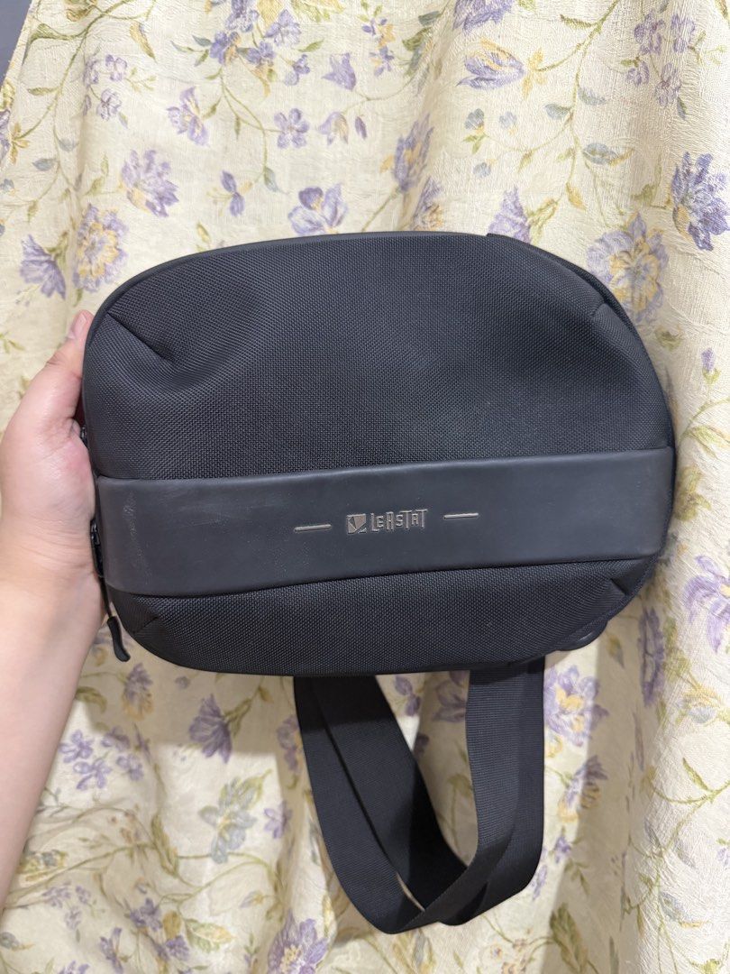 LEISTAT Black Sling Bag (Category: Cross-body Bags) located in Binan City. Submitted by prelovedlagunaph (Listing ID 1462621046, Image 1). Description: - Black LEISTAT sling bag - Main zippered compartment with internal pockets - Additional mesh pocket inside main compartment - Zippered pocket on the back - Adjustable strap for comfortable wear - Perfect for everyday use or travel - Compact and practical design.