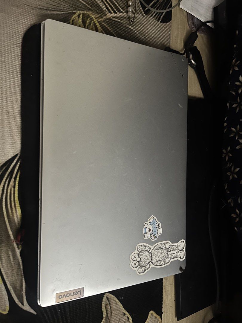 Lenovo Laptop Silver (Category: Laptops & Notebooks) located in Manila. Submitted by raymundolo37208 (Listing ID 1462563961, Image 2). Description: FOR SALE OR SWAP ( NEGOTIABLE) - Lenovo laptop with silver casing - Features stickers on the lid - Screen displays a band - Some keys are missing from the keyboard - Crack present on the top right corner of the lid - Sold as is, ideal for parts or repair .