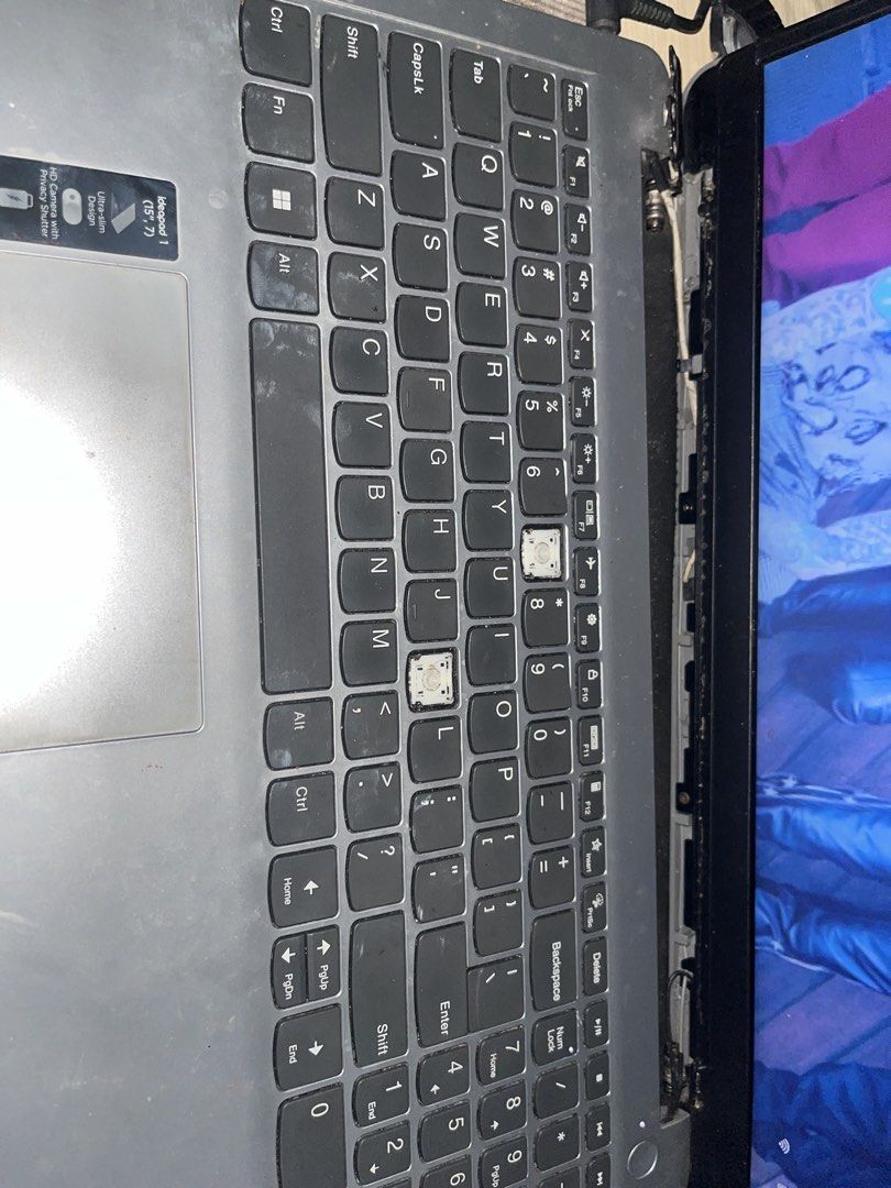 Lenovo Laptop Silver (Category: Laptops & Notebooks) located in Manila. Submitted by raymundolo37208 (Listing ID 1462563961, Image 3). Description: FOR SALE OR SWAP ( NEGOTIABLE) - Lenovo laptop with silver casing - Features stickers on the lid - Screen displays a band - Some keys are missing from the keyboard - Crack present on the top right corner of the lid - Sold as is, ideal for parts or repair .