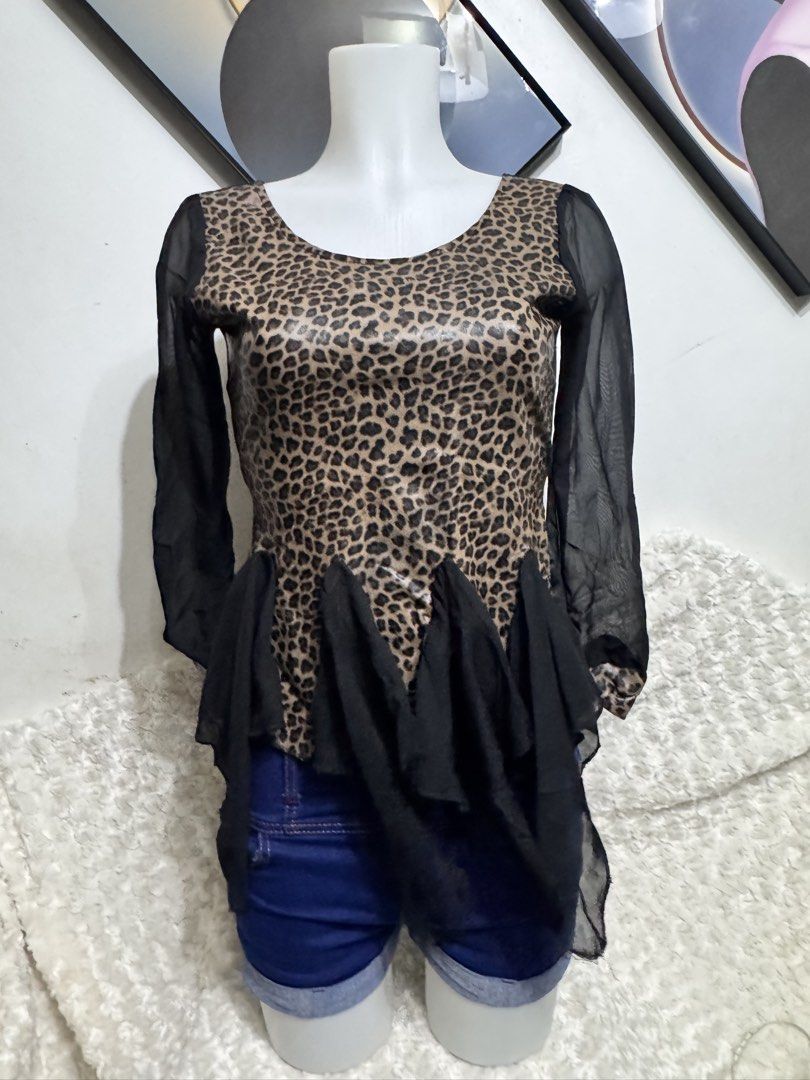Leopard Print Sheer Sleeve Peplum Top (Category: Others Tops) located in Marikina City. Submitted by lorradel (Listing ID 1462460684, Image 1). Description: - Eye-catching leopard print - Sheer black sleeves for a stylish contrast - Flattering peplum hem with ruffled chiffon detail - Versatile: pairs well with jeans or shorts - Unique design for a bold, statement look - Ideal for evening wear or making a fashion statement - MAY HAVE some washable