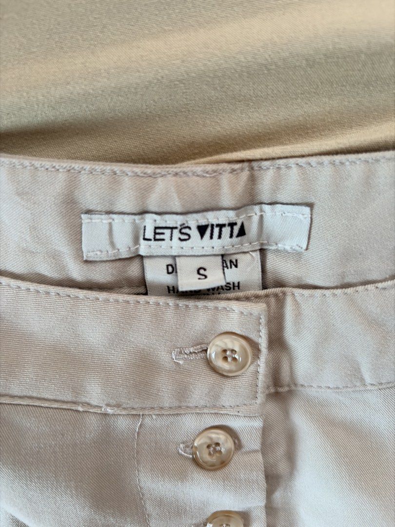 LETS VITTA Beige Pleated Button-Up Shorts Size S (Category: Shorts) located in Tabaco. Submitted by shae_3 (Listing ID 1462494829, Image 3). Description: - Brand: LETS VITTA - Color: Beige - Waist: 26 inches - Features: Pleated front, button-up closure - Fabric: Smooth - Care Instructions: Dry clean or hand wash only, do not bleach, wash separately, hang dry..
