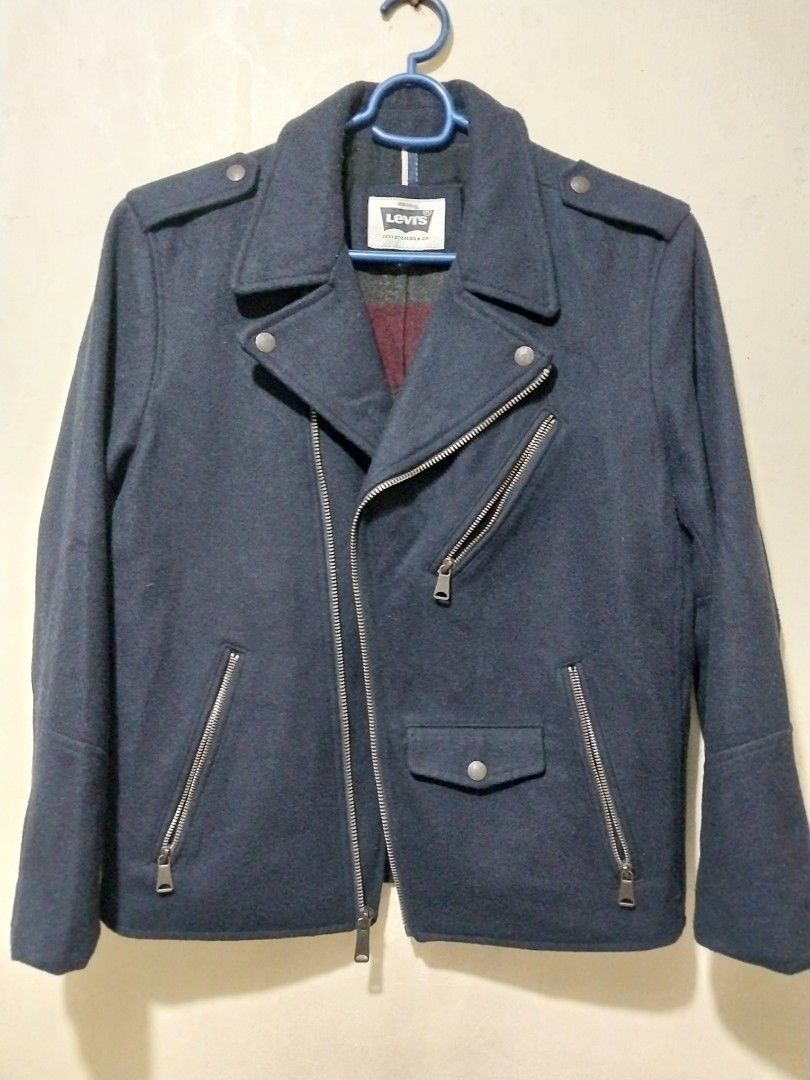 Levi's Navy Blue Wool Blend motor Jacket (Category: Coats, Jackets and Outerwear) located in Manila. Submitted by PrinceDani.Clothing (Listing ID 1462486804, Image 2). Description: - Classic Levi's biker jacket style - Navy blue color - Comfortable wool blend material - Features zippered pockets and a snap-button flap pocket - Fully lined interior for added warmth - Ideal for layering over outfits small on tag medium fit 21.5in width 24.5in lengt