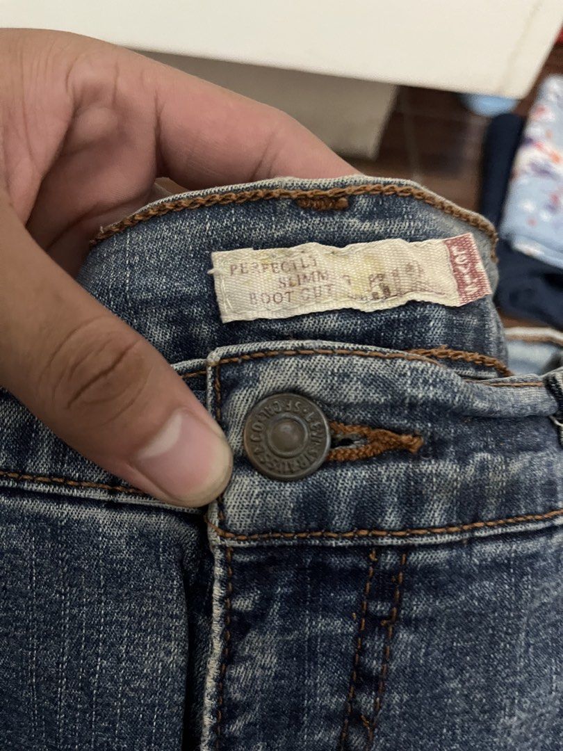 Levi's Perfectly Slim Boot Cut Jeans (Category: Jeans) located in Manila. Submitted by cypher05 (Listing ID 1462615586, Image 3). Description: - Classic blue Levi's jeans - Boot cut style - Slim fit through hip and thigh - Medium wash denim - Staple wardrobe item - Versatile for casual or dressed-up looks - Button and zip closure - Five-pocket styling.