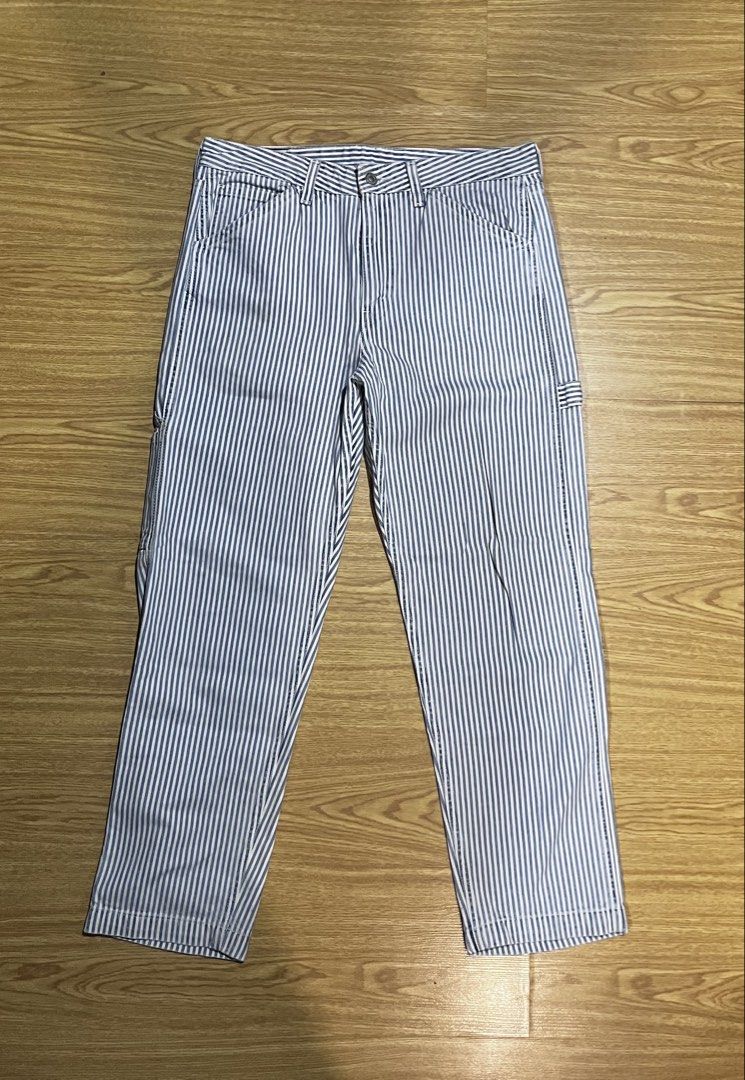 Levi's Striped Carpenter Pants (Category: Jeans) located in Quezon City. Submitted by reecepalafox (Listing ID 1462535416, Image 1). Description: - Classic Levi's carpenter pants - Blue and white pinstripe pattern - Straight leg fit - Durable denim construction - Features utility pockets and a hammer loop - Ideal for workwear or casual styling.