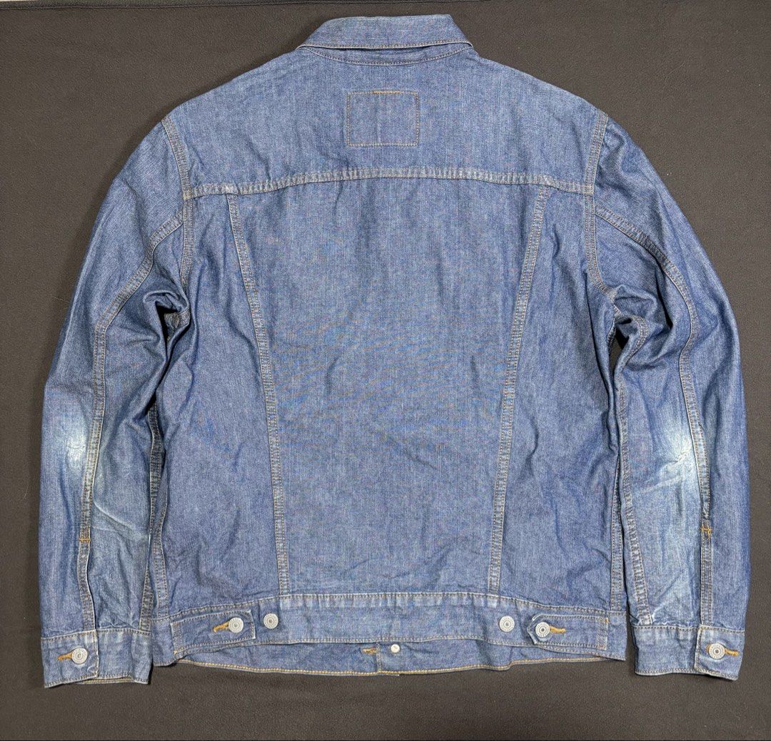 Levi's Trucker Denim Jacket Blue (Category: Coats, Jackets and Outerwear) located in Mabalacat. Submitted by _limitlessfashion (Listing ID 1462457661, Image 2). Description: - Classic Levi's blue denim jacket - Guaranteed authentic - no major issue, minimal tattered on elbow part. - still in good condition - Length 27 - Width 22 - Sleeve length 26.5 - Button-up front - Two chest pockets - Button cuffs - Shows some wear on sleeves - Small tear on 