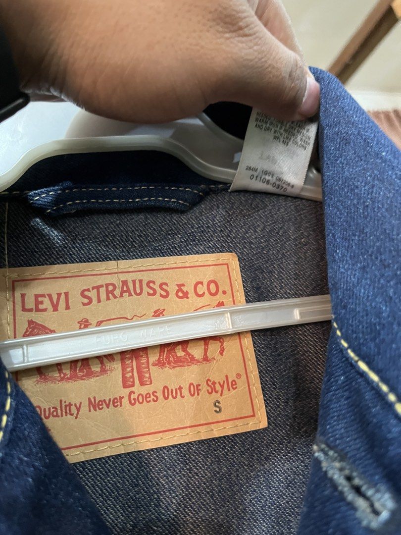 Levi's Type 1 Denim Jacket - Size S (Category: Coats, Jackets and Outerwear) located in Tabuk. Submitted by collectors_thrift_shop (Listing ID 1462450757, Image 3). Description: - Classic Levi's Type 1 denim jacket - Dark wash - Iconic design with two chest pockets - Button closure - Made in Vietnam - Size S - Great for layering or wearing on its own - Timeless wardrobe staple.