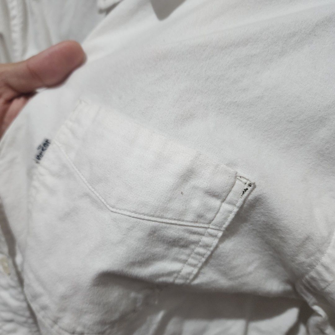 Levi's White Long Sleeve Button Down Shirt (M) (Category: Tshirts & Polo Shirts ) located in Malabon City. Submitted by grfpx (Listing ID 1462533461, Image 2). Description: - White Levi's Button-Down Shirt - Size: Medium (M) - Dimensions: 29" Length x 23" Width - Price: PHP 950.