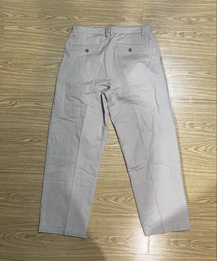 Zara Light Beige Pleated Trousers (Category: Trousers) located in Quezon City. Submitted by reecepalafox (Listing ID 1462524019, Image 2). Description: - Light beige trousers - Pleated front design - Two button closure at the waist - Two back pockets with button closure - Note: Button on the left front is slightly loose - Perfect for casual or smart casual occasions.