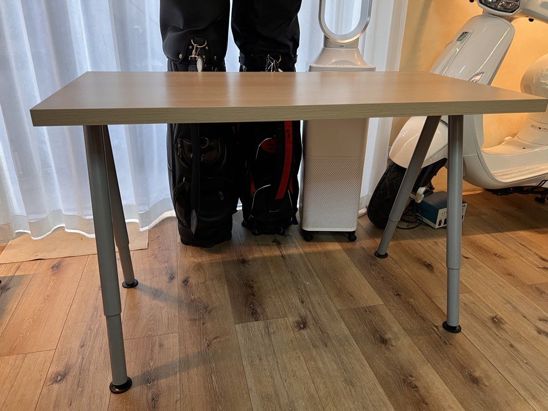 Light Wood Desk with Adjustable Legs (Category: Tables & Sets) located in Manila. Submitted by adi.f27 (Listing ID 1462448834, Image 2). Description: - Simple and functional desk with a light wood finish. - Adjustable height legs for versatile use. - Ideal for home office, study area, or crafting space. - Easy to assemble and move. - Selling as part of a decluttering effort..