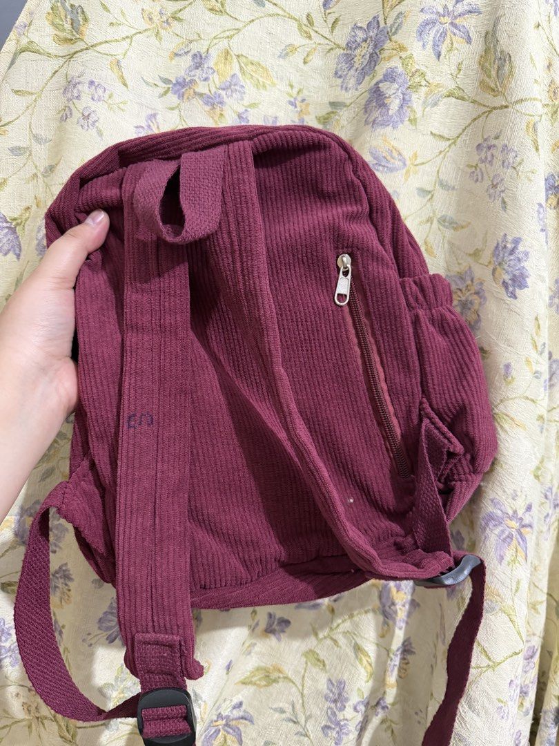 Lim & Co. Corduroy Backpack with Star Patches (Category: Backpacks) located in Binan City. Submitted by prelovedlagunaph (Listing ID 1462620318, Image 2). Description: - Adorable burgundy corduroy backpack - Fun star patches all over the front - Spacious main compartment with an inner pocket - Convenient side pockets for extra storage - Adjustable straps for a comfortable fit - Ideal for school, college, or everyday adventures.