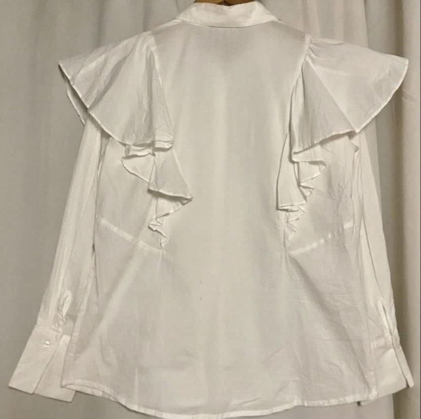 LIMITED EDITION White Ruffle Shirt (Category: Shirts) located in Caloocan City. Submitted by declutteringph. (Listing ID 1462603060, Image 3). Description: No Size on the tag! Dimensions: (inches) Shoulder Width: 18” Bust width: 21” Body Length: 24” - 27” Sleeves Length: 23” .