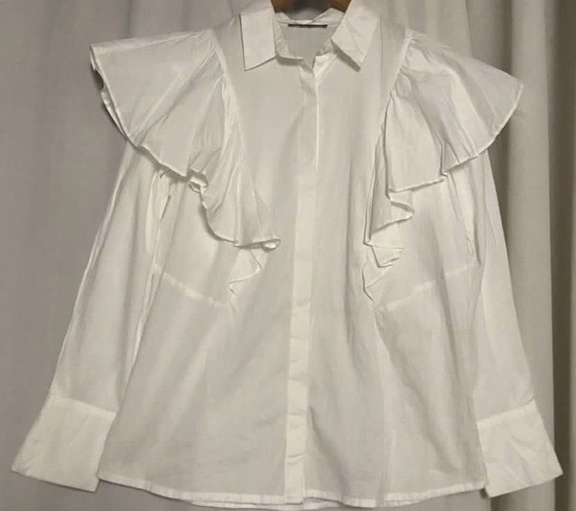 LIMITED EDITION White Ruffle Shirt (Category: Shirts) located in Caloocan City. Submitted by declutteringph. (Listing ID 1462603060, Image 2). Description: No Size on the tag! Dimensions: (inches) Shoulder Width: 18” Bust width: 21” Body Length: 24” - 27” Sleeves Length: 23” .