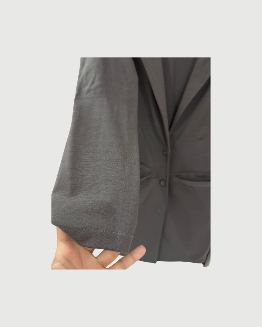 Longline Gray Blazer/Coat | XS-M (Category: Coats, Jackets and Outerwear) located in Bulacan. Submitted by _bythepetitecollective (Listing ID 1462520446, Image 2). Description: A classic long coat in a versatile dark gray shade, featuring a clean and structured silhouette. Easy to layer over dresses, skirts, trousers, or everyday outfits for a polished and sophisticated look. A timeless outerwear staple for cooler days. The material is thick! .