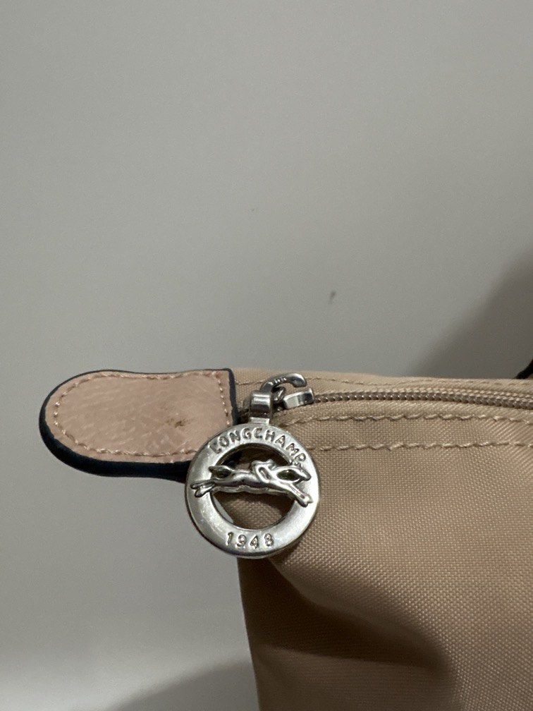 Longchamp Le Pliage Medium Long Handle (Category: Tote Bags) located in Subic. Submitted by dear.jeveaph (Listing ID 1462605917, Image 3). Description: Longchamp Le Pliage Medium Long Handle - This is NGA bag - Signs of use: dirt stains - Needs wash Friendly reminder: This is a preloved bag. Please manage your expectations. If you want a flawless bag, buy one in the store. 😊.