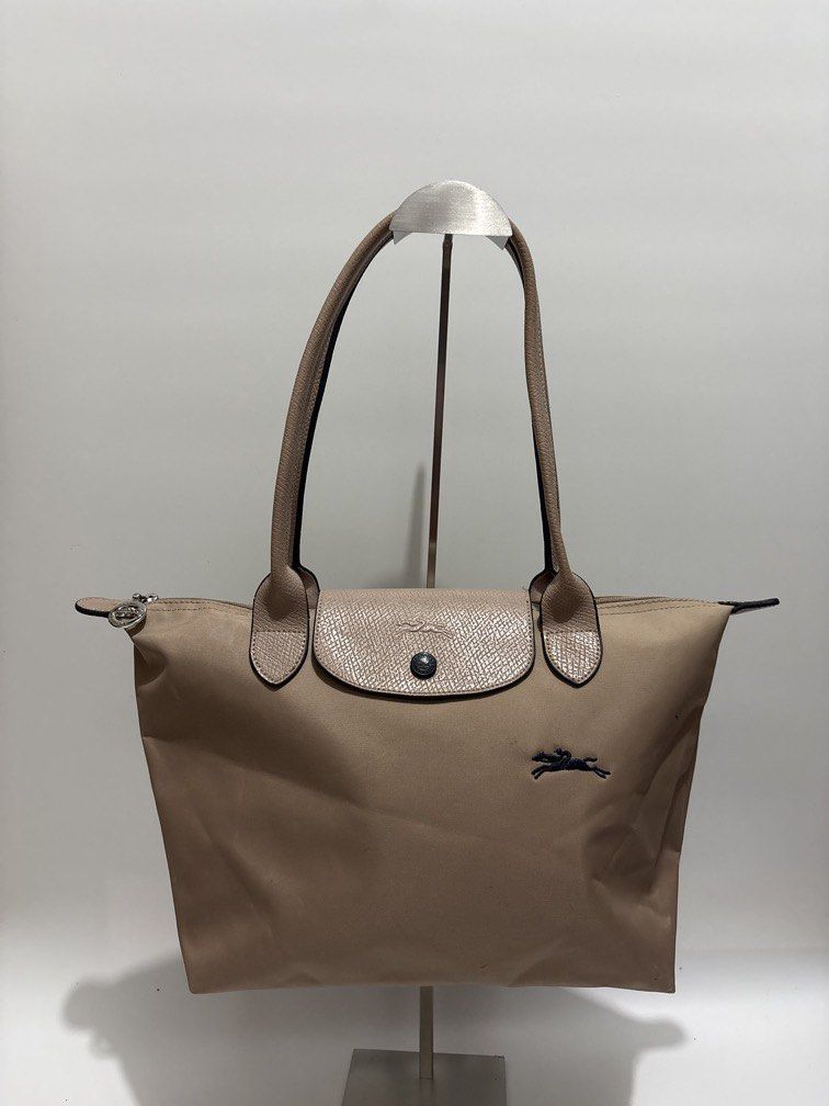 Longchamp Le Pliage Medium Long Handle (Category: Tote Bags) located in Subic. Submitted by dear.jeveaph (Listing ID 1462605917, Image 1). Description: Longchamp Le Pliage Medium Long Handle - This is NGA bag - Signs of use: dirt stains - Needs wash Friendly reminder: This is a preloved bag. Please manage your expectations. If you want a flawless bag, buy one in the store. 😊.