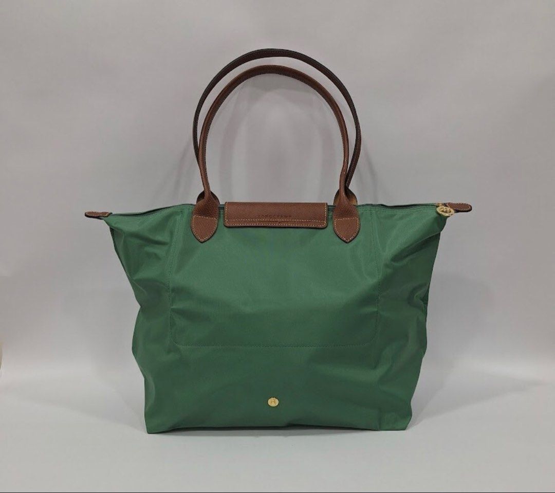 Longchamp Le Pliage Tote Bag Green (Category: Luxury Bags & Wallets) located in Manila. Submitted by elcanto (Listing ID 1462626245, Image 2). Description: - Model/Series: Longchamp Le Pliage Original Large Shoulder Bag (Reference Code: L1899089P84) Color: Sauge (a soft muted sage green tone) paired with classic brown Russian leather trimmings. Dimensions: Approximately 12.2” W (at base) x 11.8” H x 7.5” D (31 cm x 30 cm x 19 cm).Handle Drop: 9.8