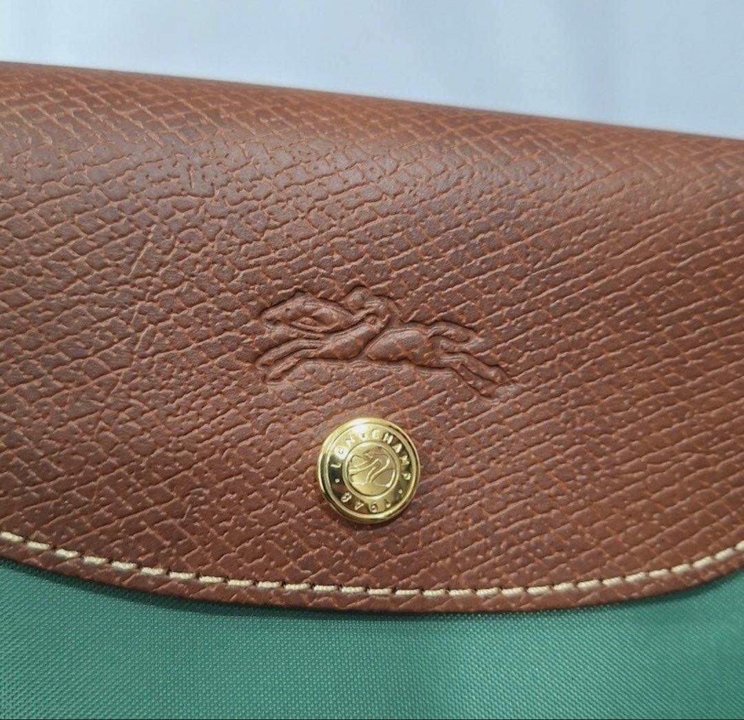 Longchamp Le Pliage Tote Bag Green (Category: Luxury Bags & Wallets) located in Manila. Submitted by elcanto (Listing ID 1462626245, Image 3). Description: - Model/Series: Longchamp Le Pliage Original Large Shoulder Bag (Reference Code: L1899089P84) Color: Sauge (a soft muted sage green tone) paired with classic brown Russian leather trimmings. Dimensions: Approximately 12.2” W (at base) x 11.8” H x 7.5” D (31 cm x 30 cm x 19 cm).Handle Drop: 9.8