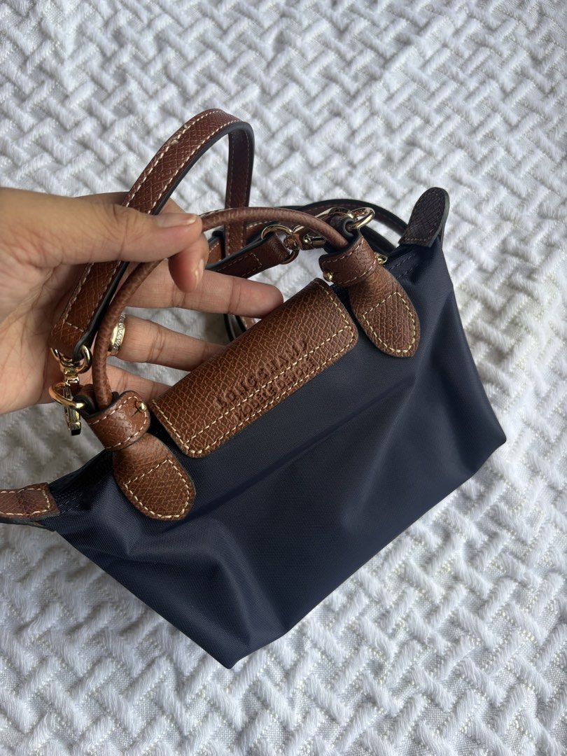 Longchamp mini navy (Category: Cross-body Bags) located in Bacolod City. Submitted by poppylouri.ph (Listing ID 1462455899, Image 2). Description: Authentic. Like new condition LC mini in navy. Ready to ship. MOP: Gcash, gotyme bank or BPI only. NO COD. Pay now, ship tomorrow. SF c/o buyer. .