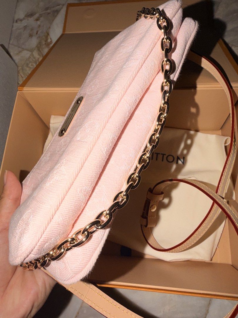 Louis Vuitton Pink Monogram Pochette with Gold Chain (Category: Luxury Bags & Wallets) located in Las Pinas. Submitted by twiceloved24 (Listing ID 1462483273, Image 3). Description: - Lovely pink monogram canvas - Chic gold chain strap - Detachable leather strap - Double zip closure for easy access - Interior leather tag: 'LOUIS VUITTON PARIS made in Spain' - Comes with dust bag and box.