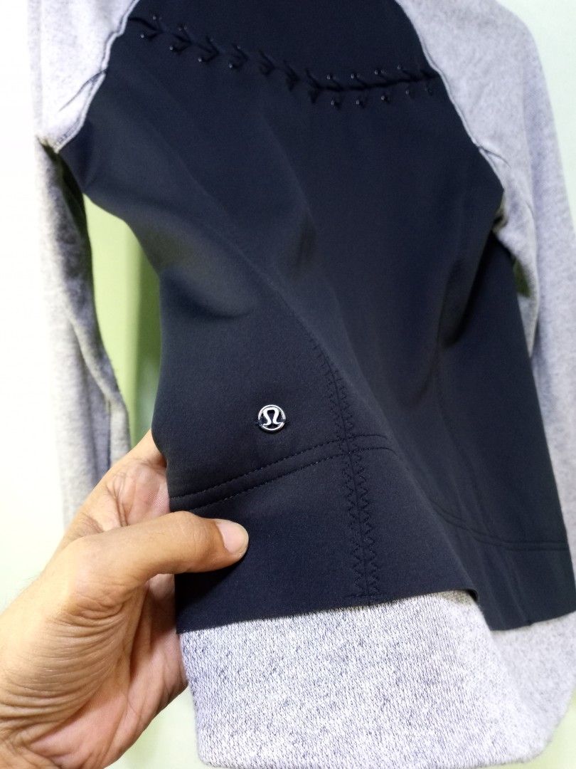 Lululemon Black Grey Zip-Up Jacket (Category: Coats, Jackets and Outerwear) located in Manila. Submitted by onewikstraight (Listing ID 1462565601, Image 3). Description: - Lululemon jacket in black and grey. - Raglan sleeves for comfortable movement. - Full zipper front closure. - Two secure zip pockets for essentials. - Unique decorative beaded detail on the back. - Size 6 19W 25L - Versatile for workouts or everyday casual wear. - Combines comf