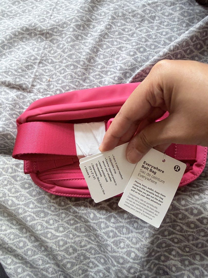 Lululemon Everywhere Belt Bag - Pink (Category: Cross-body Bags) located in Makati City. Submitted by purewind.a22dcd (Listing ID 1462531314, Image 3). Description: - Bright pink Lululemon Everywhere Belt Bag - Water-repellent fabric - Adjustable strap for comfortable wear - Zippered pockets for secure storage - Ideal for carrying essentials on the go - Dimensions: 7.5" (length) x 2" (width) x 5" (height).
