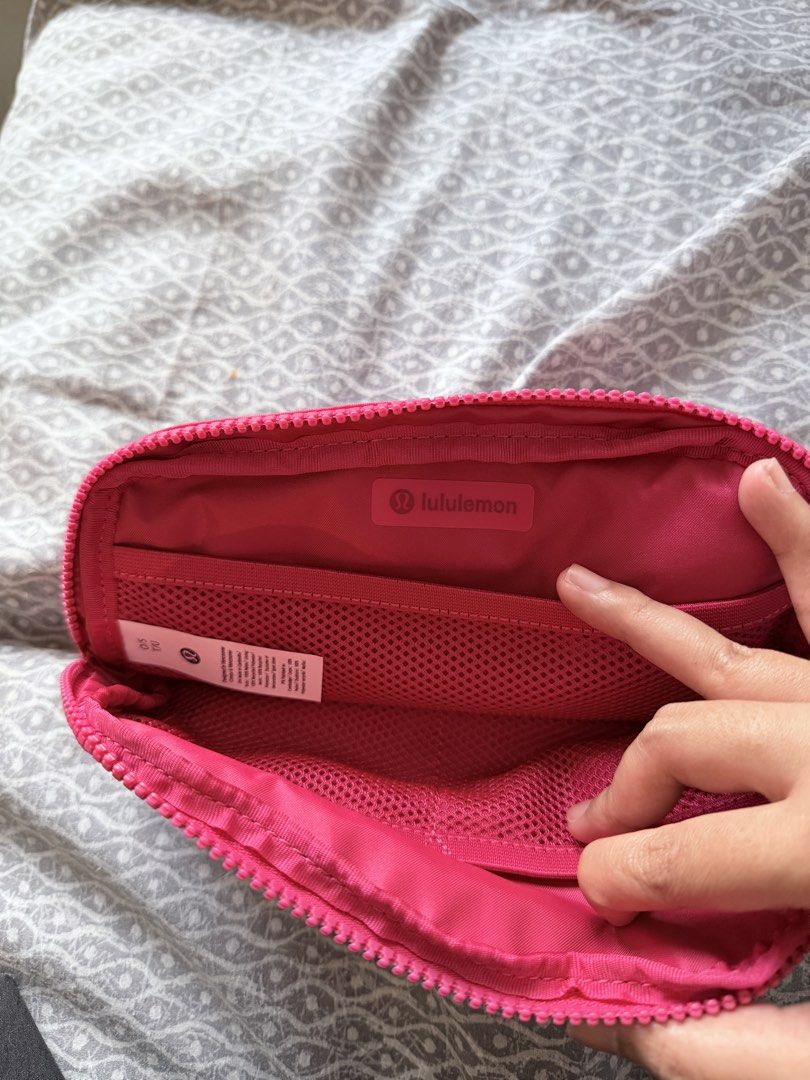 Lululemon Everywhere Belt Bag - Pink (Category: Cross-body Bags) located in Makati City. Submitted by purewind.a22dcd (Listing ID 1462531314, Image 2). Description: - Bright pink Lululemon Everywhere Belt Bag - Water-repellent fabric - Adjustable strap for comfortable wear - Zippered pockets for secure storage - Ideal for carrying essentials on the go - Dimensions: 7.5" (length) x 2" (width) x 5" (height).