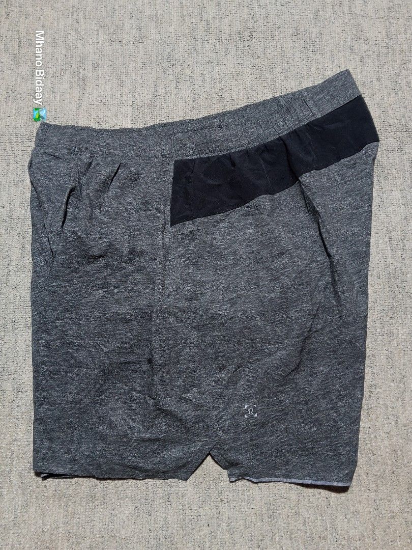 Lululemon Men's 6" Surge Lined Short (Category: Shorts) located in Valencia. Submitted by mhano_bidaay_outdoors_218 (Listing ID 1462557933, Image 3). Description: - Lululemon Men's Shorts - Size: Extra Large (XL) - Waistline: 35-37 inches - Length: 16 inches - Leg Opening: 13.5 inches - Fabric: Quick-drying and lightweight - Color: Dark grey with black accents - Ideal for: Workouts or casual wear.