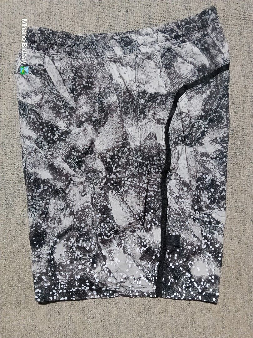 Lululemon Men's 7" Pace Breaker Unlined Short (Reflectorized) (Category: Shorts) located in Valencia. Submitted by mhano_bidaay_outdoors_218 (Listing ID 1462557917, Image 2). Description: - Lululemon Men's 7" Pace Breaker Shorts - Size: Extra Small (fits waist 28-30") - Color: Black and white pattern - Features: Unlined, quick-drying fabric - Safety: Reflectorized dots for visibility during night runs - Measurements: Length 16", Leg Opening 10.5"