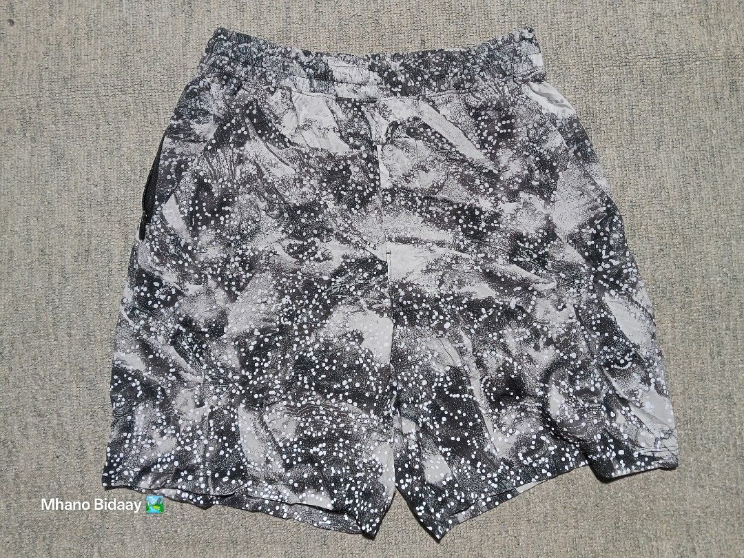 Lululemon Men's 7" Pace Breaker Unlined Short (Reflectorized) (Category: Shorts) located in Valencia. Submitted by mhano_bidaay_outdoors_218 (Listing ID 1462557917, Image 3). Description: - Lululemon Men's 7" Pace Breaker Shorts - Size: Extra Small (fits waist 28-30") - Color: Black and white pattern - Features: Unlined, quick-drying fabric - Safety: Reflectorized dots for visibility during night runs - Measurements: Length 16", Leg Opening 10.5"