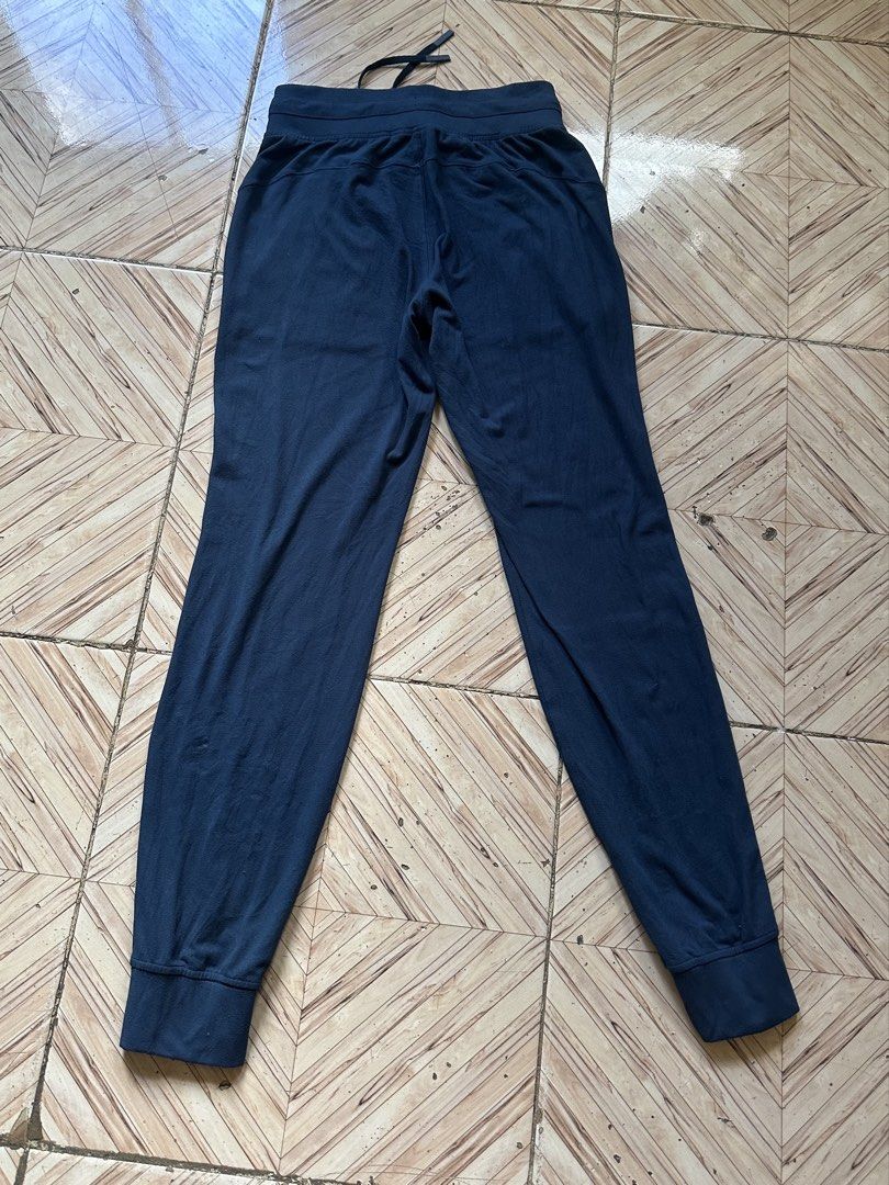 Lululemon Navy Blue Jogger Pants Size 4 (Category: Other Bottoms) located in Angeles City. Submitted by alejeong27 (Listing ID 1462499933, Image 2). Description: - Navy blue Lululemon joggers - Size 4 - Extremely comfortable and soft material - Elastic waistband with drawstring for a perfect fit - Cuffed ankles for a sleek look - Two convenient side pockets - Ideal for both lounging at home and active workouts.