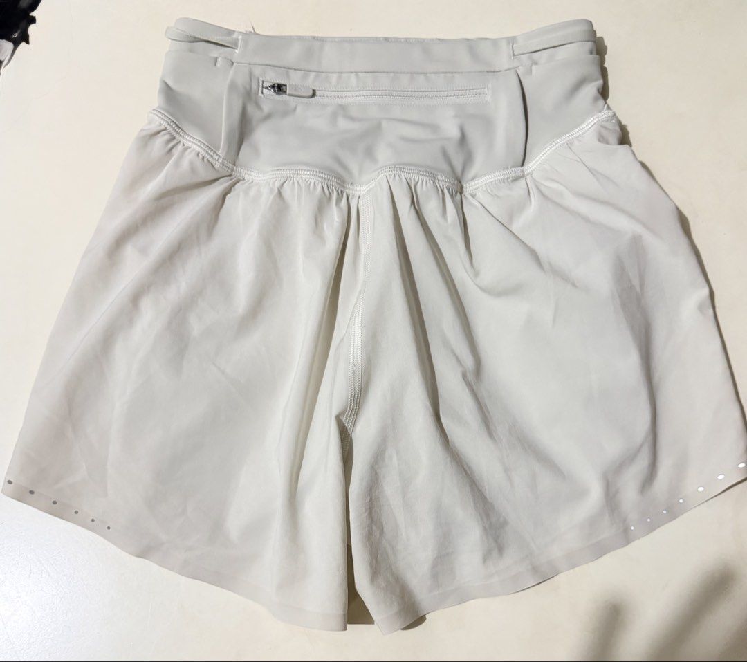 Lululemon Speed Up Shorts Size 2 Light Grey (Category: Activewear) located in Manila. Submitted by jazzyminey (Listing ID 1462604990, Image 2). Description: - Lululemon Speed Up Shorts - Color: Light Grey - Size: 2 - Material: Recycled Polyester and Lycra - Features: Back zippered pocket, perforated front details, reflective hem details - Ideal for: Running, training.